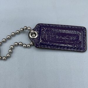 Coach purple patent leather handbag tag